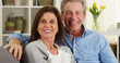 © Mark Adams - Senior couple laughing and talking to camera