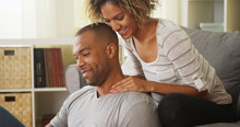Black Girlfriend Giving Boyfriend Neck Massage