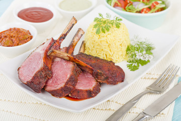 Wall Mural - Lamb Cutlets - Spicy roasted lamb cutlets served saffron rice, salad and dips.