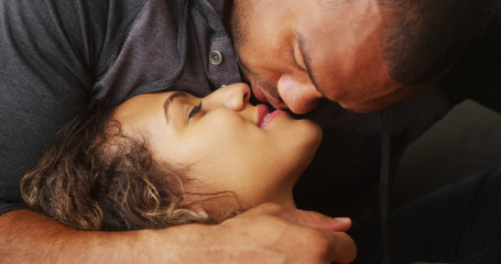 Wall Mural - Closeup of African boyfriend kissing his girlfriend