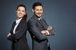© ZoomTeam - Business couple on blue background