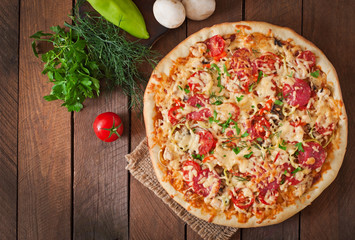 Wall Mural - Pizza with salami, tomatoes and mushrooms