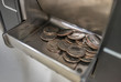 © srongkrod - coins from a bill change machine.