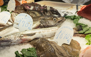 Sticker - hake and sole fishes at Mercat de Sant Josep de la Boqueria market in Barcelona, Spain