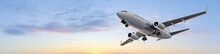Modern Passenger Airplane Flight In Sunset Panorama
