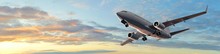 Modern Passenger Airplane Flight In Sunset Panorama