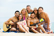 © JackF - Friends with guitar at beach .