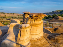 Hoodoos Bathed In The Warm Light Of A Summer Sunset At Drumheller Alberta Canada.