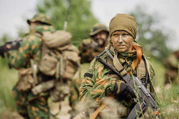 Wall Mural - Group of soldiers special forces during the raid in the forest