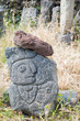 Grey lava sculpture of a man's profile