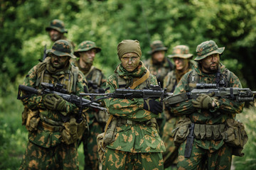 Group of soldiers special forces during the raid in the forest