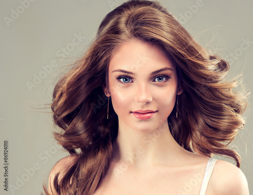 Fotografie, Obraz Beautiful young girl with long hairstyle curly hair