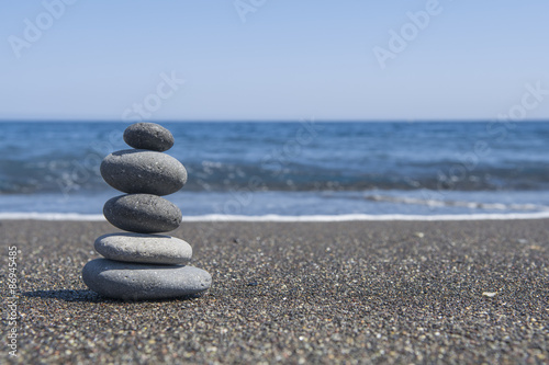 Naklejka - mata magnetyczna na lodówkę Balance stones on the beach. Selective focus