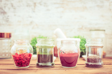 Wall Mural - Goji,chia, aroina and spirulina (superfood) on wooden tabe