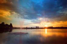 Sunset Of The Lake With Fountains