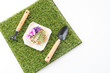 green grass turf on white with fork and spade