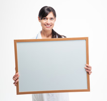 Female Doctor Holding Blank White Board