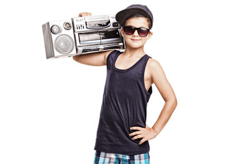 Fototapete - Cool boy in hip hop outfit holding a ghetto blaster