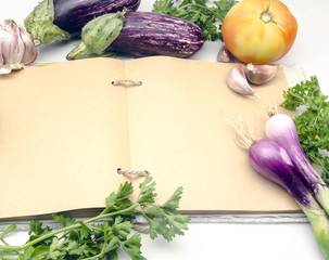 Canvas Print - Cuaderno de recetas de cocina abierto en pagina en blanco rodeado de vegetales