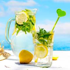 Lemon drink  and beach in the background