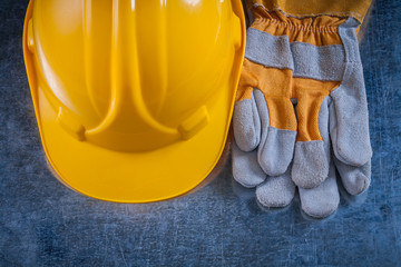 Protective building helmet and safety working gloves on scratche