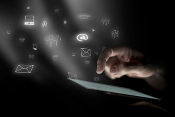 Wall Mural - male hand hovers over digital tablet