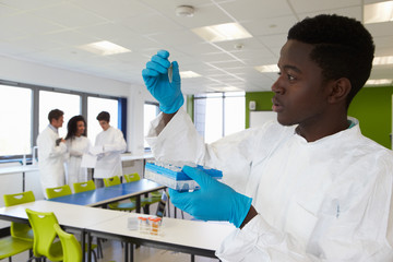 Group Of College Students In Science Class With Experiment