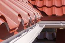 New Red Metal Tile With White Rain Gutter