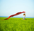 © mr.markin - Young happy woman in wheat field with fabric. Summer lifestyle