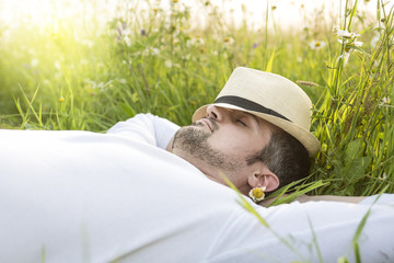 Happy young man in a field