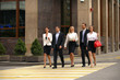 © Andrey_Arkusha - Five successful business people crossing the street in the city