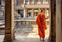 Buddhist Monk Exploring Courtyards Of Angkor Wat, Siem Reap