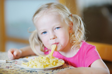 Wall Mural - Cute funny girl eating spaghetti