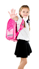 Wall Mural - Smiling schoolgirl with backpack saying good bye