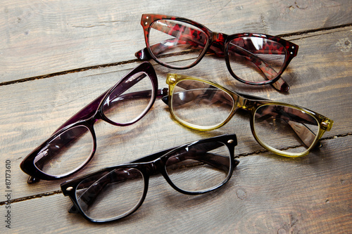 Fényképezés Set of reading glasses on wooden background