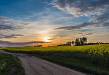 Beautiful Sunset On A Country  Road With Blue Sky And Clouds