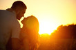 © Nastassia Yakushevic - romantic sensual young couple in love kissing at the sunset