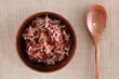 Red rice in a small ceramic dish