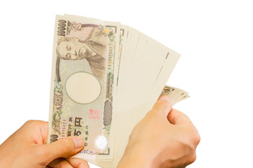 counting Japanese currency with hands