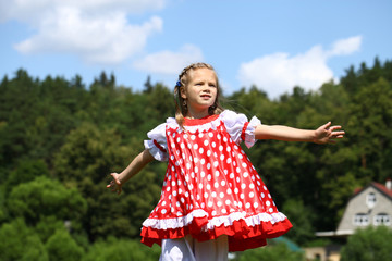 Poster - Little girl in a red polka-dot sundress into a major run on the