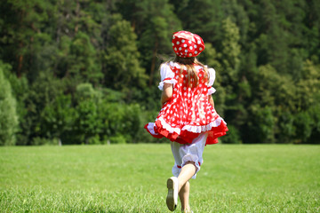 Poster - Little girl in a red polka-dot sundress into a major run on the