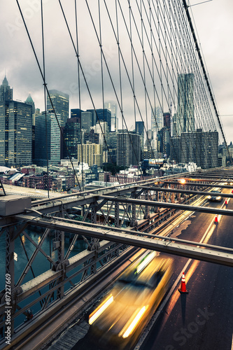 Fototapeta na wymiar Taxi cab crossing the Brooklyn Bridge