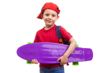 Schoolkid standing with skateboard and backpack on white backgro