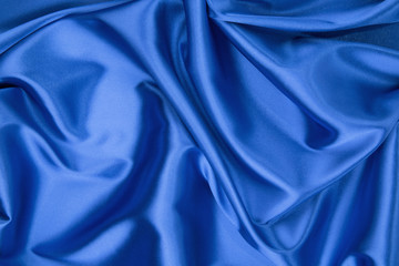 Wall Mural - Some soft folds of blue silk cloth.