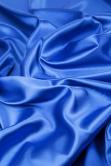 Wall Mural - Closeup of blue silk cloth.
