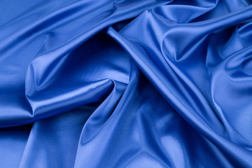 Wall Mural - Soft folds of deep blue silk cloth.