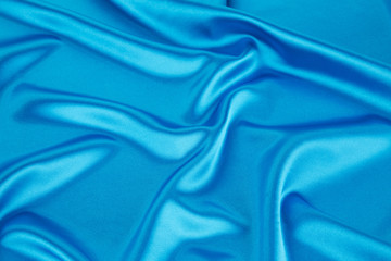 Wall Mural - Soft folds of light blue silk cloth.