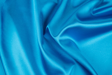 Wall Mural - Soft folds of light blue silk texture.