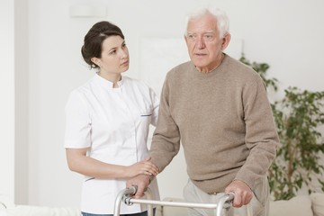 Wall Mural - Senior man using walking frame