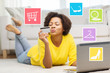 © Syda Productions - happy african woman with laptop and credit card